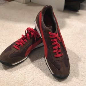Brown and red Puma sneakers